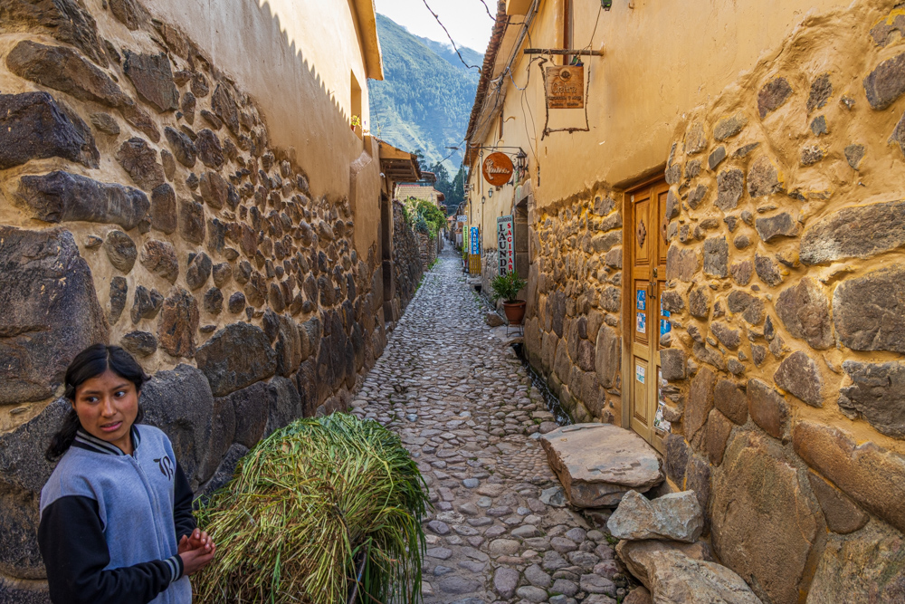 Ollantaytambo with girl carrying alfalfa