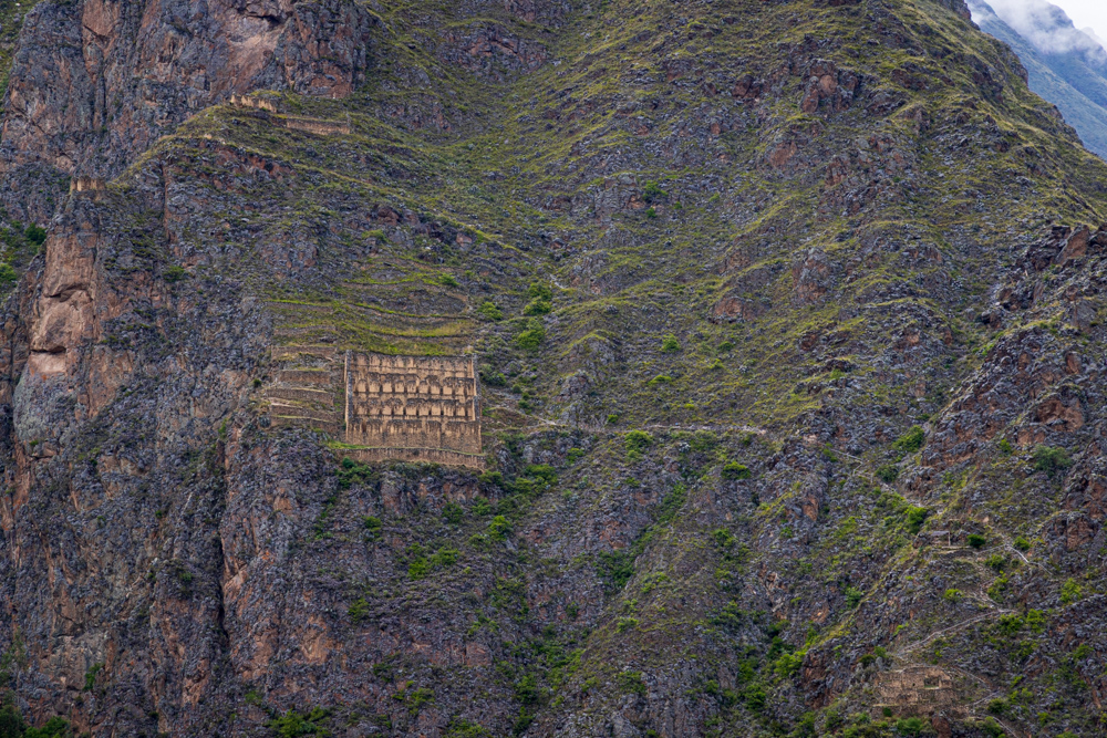 Grain storage bins and trails across the valley